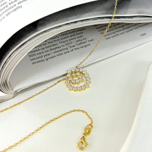 Gold Plated Silver Twirl Design Necklace With White CZ